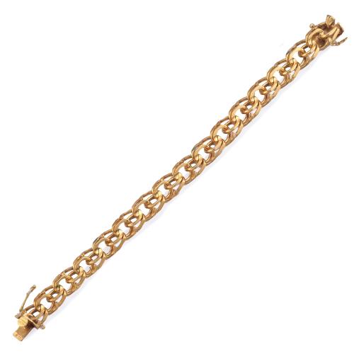 Pulsera con doble eslabón barbado en oro amarillo de 18K.