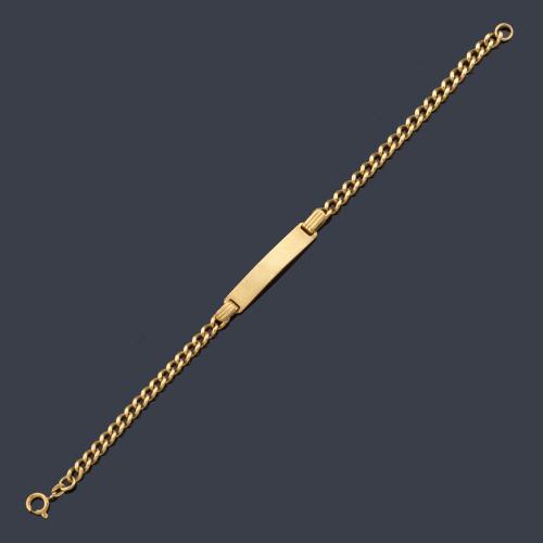 Pulsera-esclava con placa sin inscripción en oro amarillo de 18K.