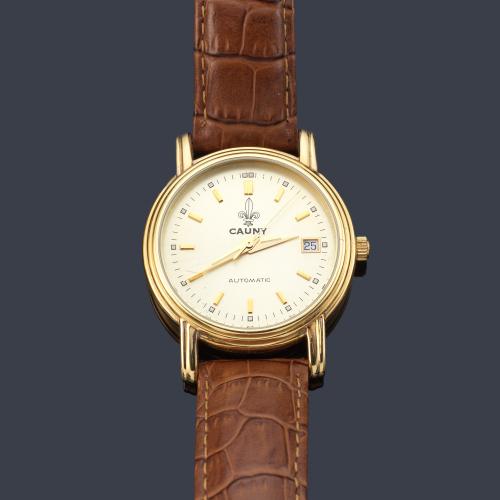 CAUNY Prima de caballero con caja en oro amarillo de 18 K.