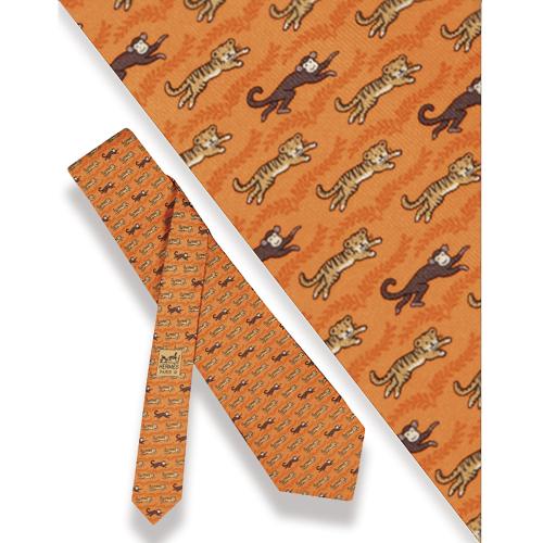 Corbata Hermés, monos y tigres fondo naranja.