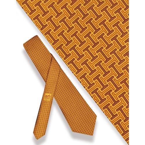 Corbata Hermès, logotipo sobre fondo naranja