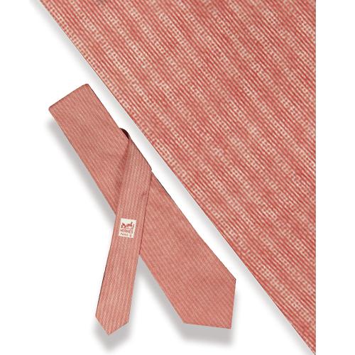 Corbata Hermès, motivos blancos sobre coral en seda