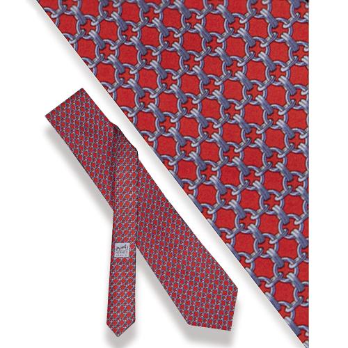 Corbata Hermès, Motivos circulares sobre fondo rojo.