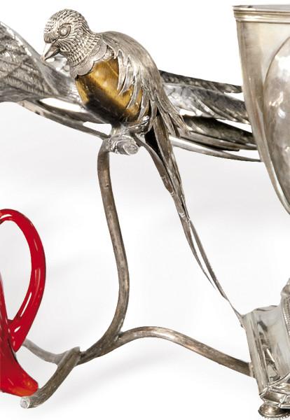 Pájaro en rama de plata mejicana punzonada Ley 925 con cuerpo de ojo de tigre.