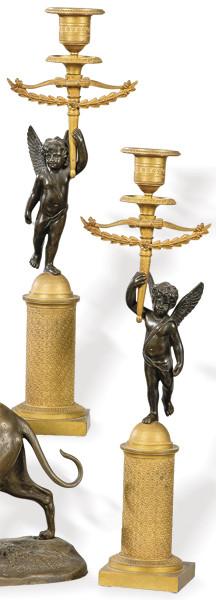 Pareja de candeleros de bronce dorado y patinado, Francia S. XIX.