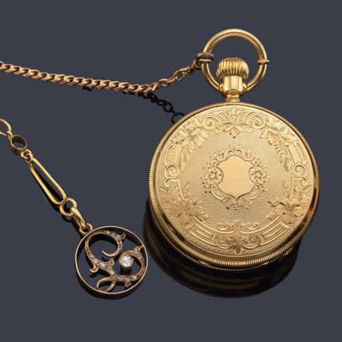 J. TRILLAR Geneve, reloj saboneta con caja en oro amarillo de 18 K y leontina en oro amarillo de 18 K.