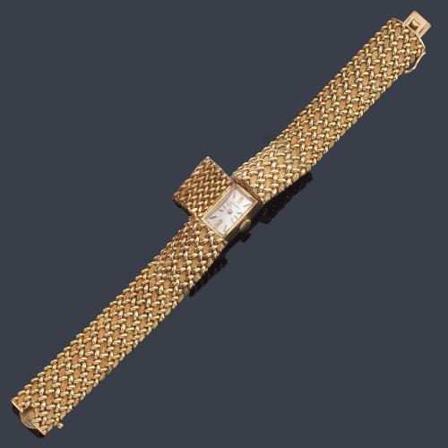 Pulsera-reloj CARTIER de señora con caja y brazalete en oro amarillo de 14 K.