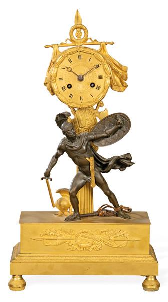 Reloj de época de Restauración en bronce dorado y bronce patinado.