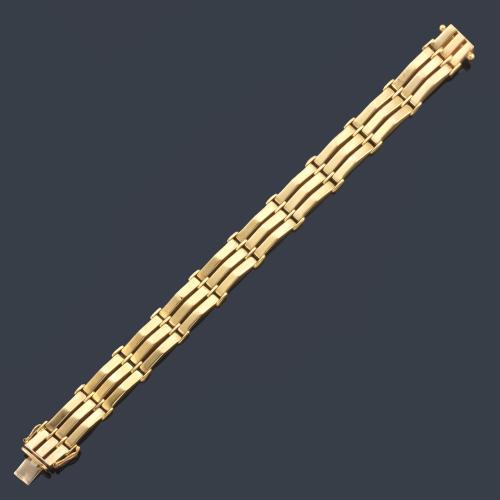 Pulsera articulada en oro amarillo de 18K.
