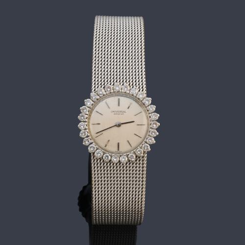 UNIVERSAL de señora con caja y brazalete en oro blanco de 18 K con orla de brillantes.