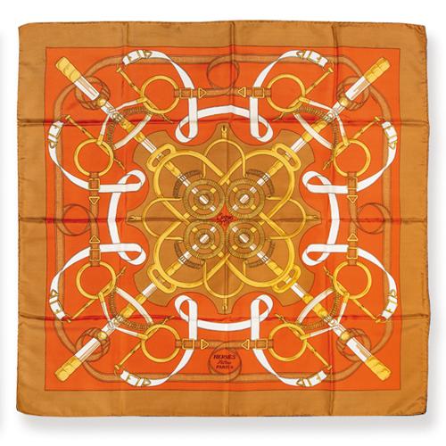Pañuelo Hermès 'Eperon d' Or' en tonos naranjas y ocres.