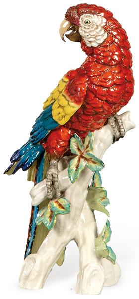 Figura de loro sobre tronco de arbol con hojas en porcelana modelada, pintada y esmaltada de Salvador Mallol. Manises, S. XX