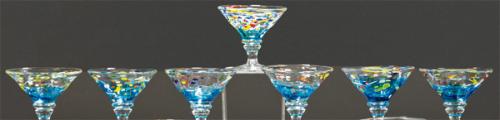 Juego de siete copas de helado de cristal de Murano transparentes con manchas de colores.
