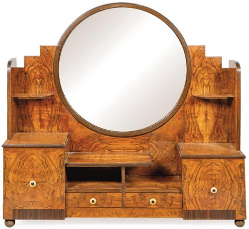 Mueble tocador Art Decó en madera de nogal, con un gran espejo circular moldurado, estantes y compartimentos.