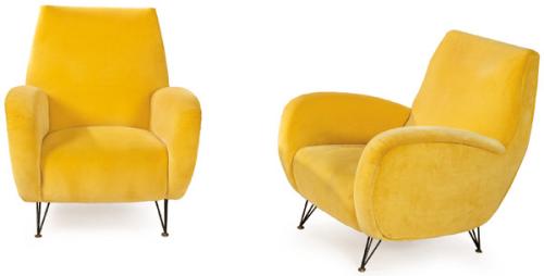 Pareja de butacas con brazos y respaldo integrados en curvas continuas.