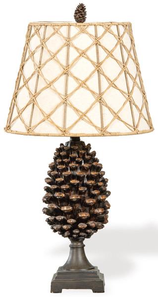 Lámpara de de madera tallada con vástago en forma de gran piña y pantalla decorada con cuerda.