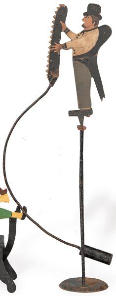 Tentetieso en hierro pintado con forma de mago con serrucho.