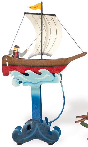 Tentetieso de hierro pintado en forma de barco con pirata.