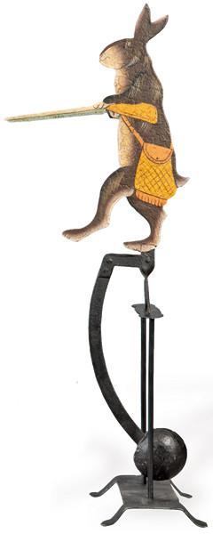 Tentetieso de hierro pintado en forma de conjeo cazador.