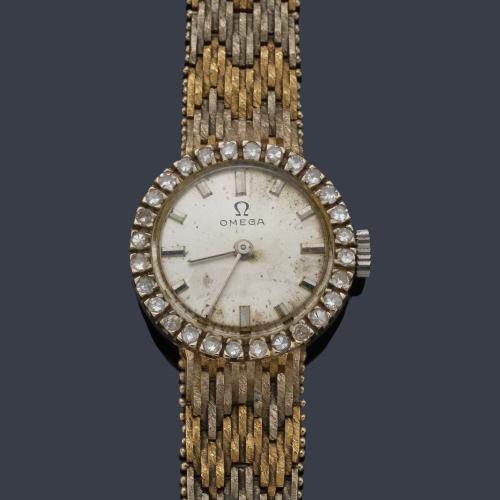 OMEGA de señora con caja y brazalete en oro amarillo y blanco de 18 K