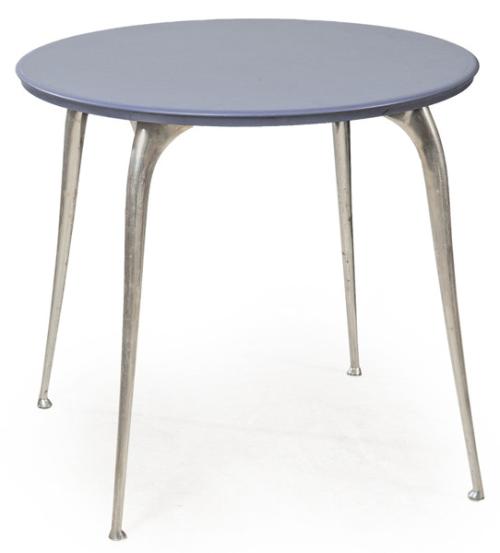 Philippe Starck (París, 1949) para Vitra, ca. 1992 Mesa redonda modelo "Louise", con tablero circular laminado en color azul oscuro, acompañado de patas esculturales en fundición de aluminio satinado. Edición año 2000