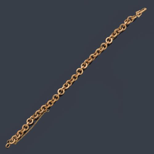 Pulsera con eslabones circulares en oro amarillo de 18K.