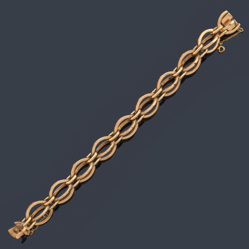 Pulsera años '70 con eslabones ovalados en montura de oro amarillo de 18K.