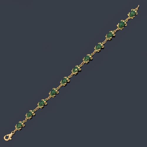 Pulsera con motivos de ranitas decoradas con esmalte verde (con faltas) en montura de oro amarillo de 18K.