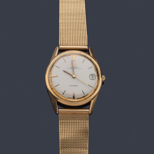 UNIVERSAL de caballero con caja y brazalete en oro amarillo de 18 K.