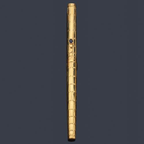 Pluma en oro amarillo de 18 K con decoración piel de serpiente.