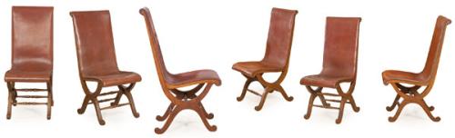 Conjunto de 6 sillas modelo Slipper siguiendo diseño de Pierre Lottier, con estructura en "X" unida por chambrana torneada, en madera de castaño teñido y cuero marrón.
