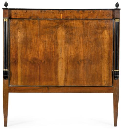 Cabecero de cama fernandino  en madera de caoba y palma de caoba flanqueado por columnas. S. XIX.