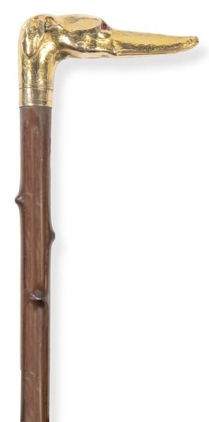 Bastón con pomo de cabeza de galgo en plata sobredorada.