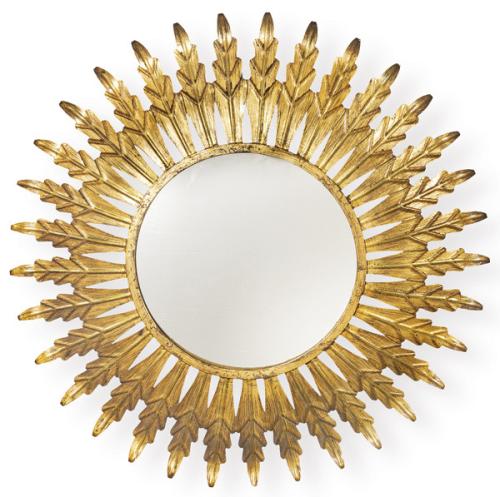 Espejo sol con hojas concéntricas en metal dorado. 