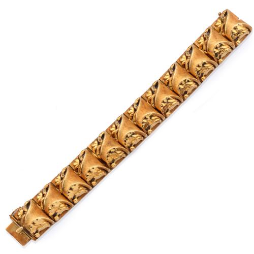Pulsera con eslabones con diseño floral calado en montura de oro amarillo de 18K.