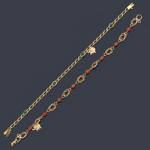 Dos pulseras con cuentas esféricas de coral y esmeraldas talla oval, con un motivo de un elefante cada uno.