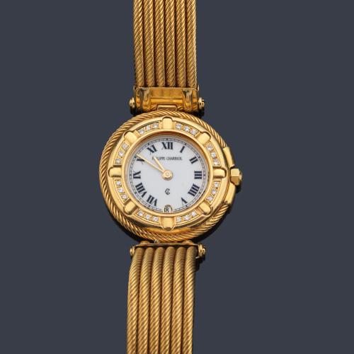  PHILIPPE CHARRIOL de señora con caja y brazalete en oro amarillo de 18 K y orla de brillantes.