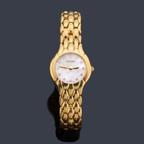 BUCHERER de señora con caja y brazalete en oro amarillo de 18 K.