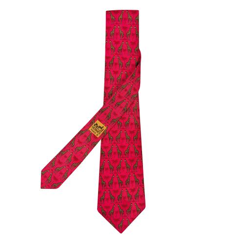 Corbata Hermés motivos de jirafas y palmeras en color rosa.