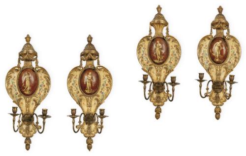  Juego de cuatro apliques de madera tallada, policromada y dorada con brazos de latón S. XX.