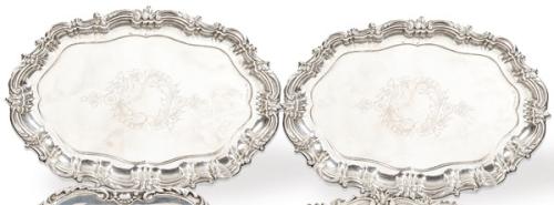 Pareja de bandejas ovales de plata española punzonada 1ª Ley de Montejo con marca comercial de Ferreiro.