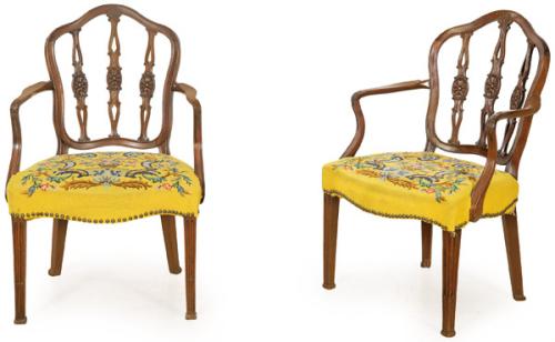  Pareja de butacas Jorge III en madera de caoba con respaldo calado y tallado, asientos tapizados en "petit-point".