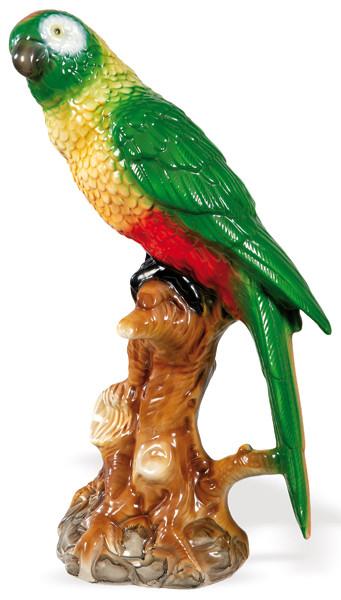 Figura de loro sobre tronco de árbol en cerámica modelada, pintada y esmaltada de Rattermann (Hamburgo)