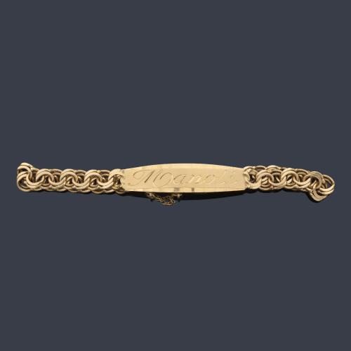Pulsera - esclava con placa nominal con el nombre de 'Manoli' en oro amarillo de 18K.