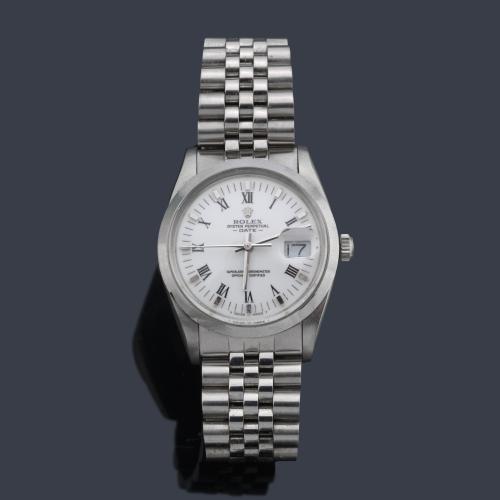ROLEX Oyster Perpetual Date, Superlative Chronometer Officially Certified. Ref. 15000, para caballero con caja y brazalete en acero.