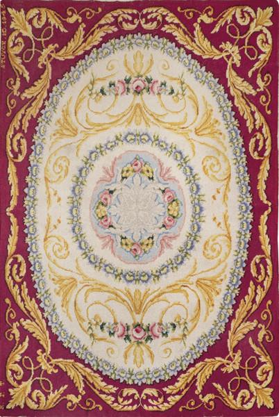 Alfombra española en lana de la Real Fábrica de Tapices, diseño Savonnerie, firmada y fechada "Stuyck MD 1945".