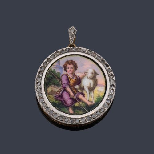  Medalla devocional con La Imagen de San Juanito pintado en esmalte policromado, en montura de oro amarillo de 18K y vista en platino. Ppios S. XX.