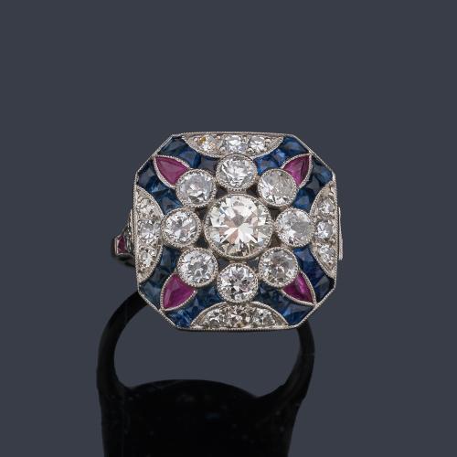  Anillo con brillante central de aprox. 0,50ct con rubíes y zafiros calibrados, con orla de brillantes de aprox. 1,35 ct en total.