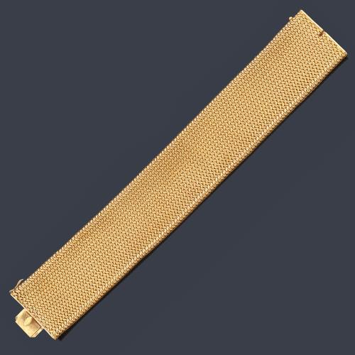 Pulsera ancha con diseño de malla realizada en oro amarillo de 18K.