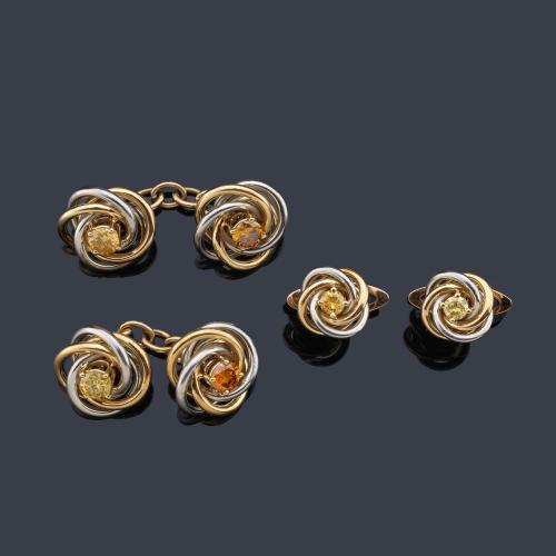 Gemelos y botonadura con diseño de nudo con un diamante 'fancy' en montura de oro blanco y amarillo de 18K.